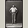 Man standing with arms on hips