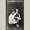 Boy in Fedora Holding Younger Brother