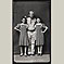 Soldier with Two Girls in Polka Dot Dresses