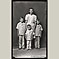 Woman in Striped Dress with Three Sons