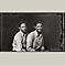 Two Young Men Sitting Together