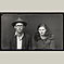 Man in Fedora and Glasses with Wife