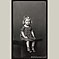 Young Girl in Dress Sitting on Platform